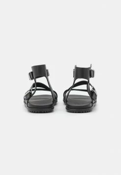 UGG SOLIVAN STRAP - Sandals - Black -UGG Shop 9324953fd56142109b4c3229179f64bc